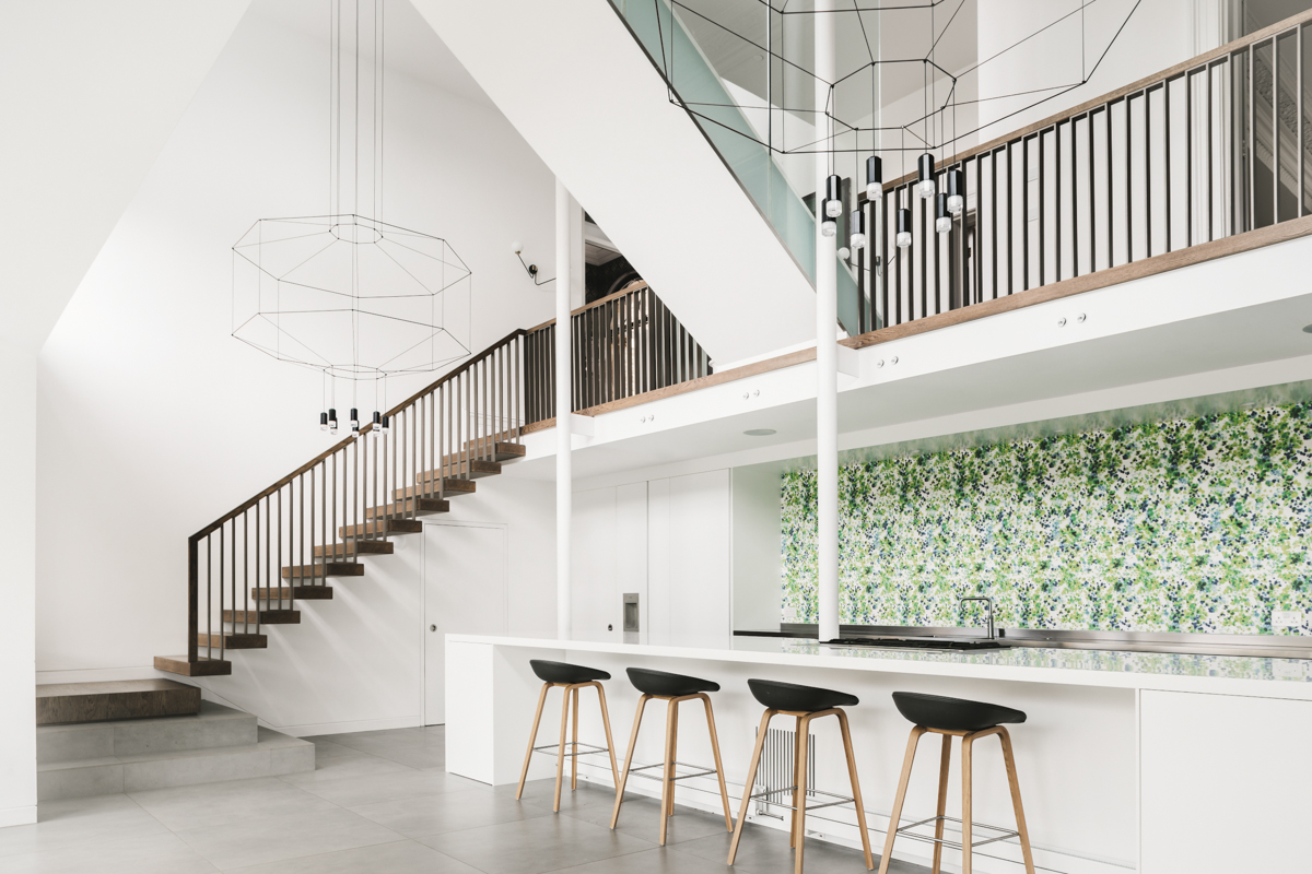 Large kitchen island and floating staircase