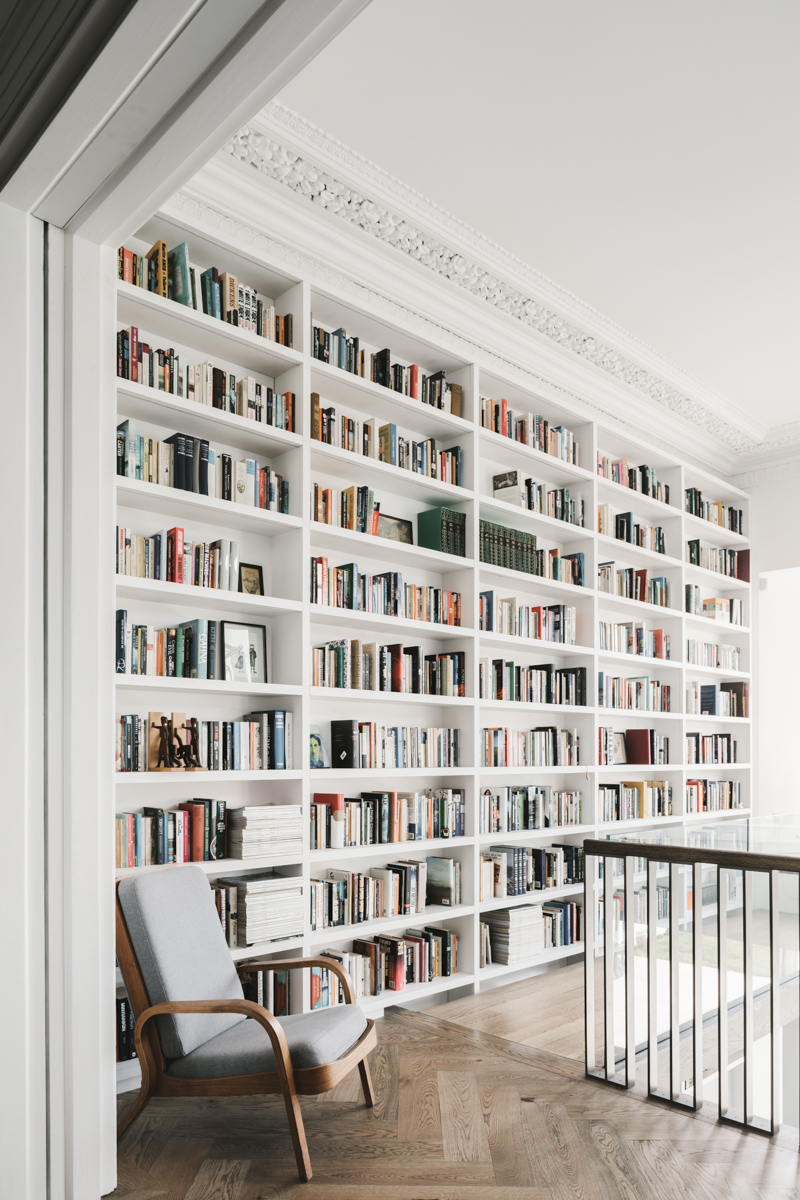 Full height bookcase in ornate period room