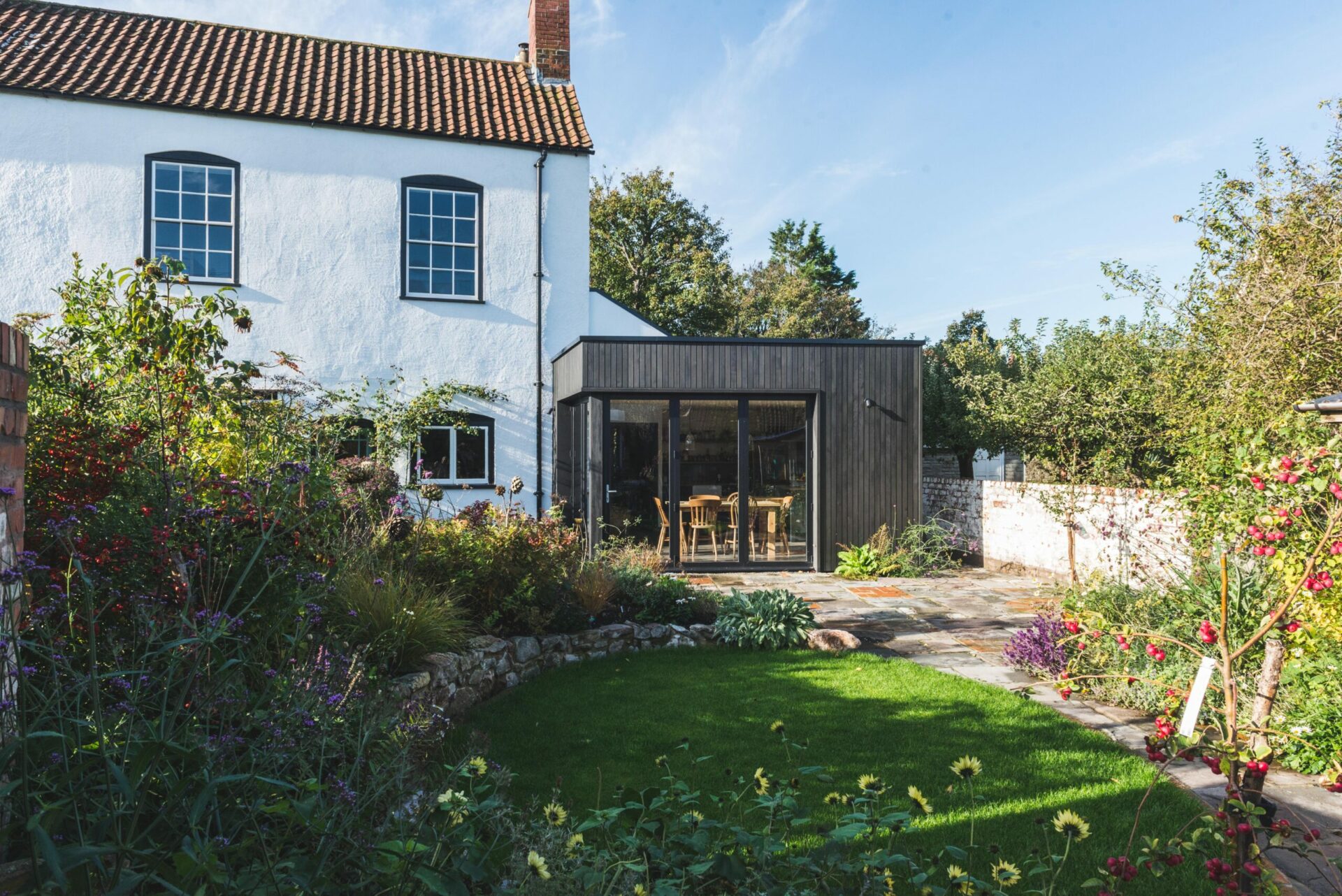 Dark timber clad extension to period house