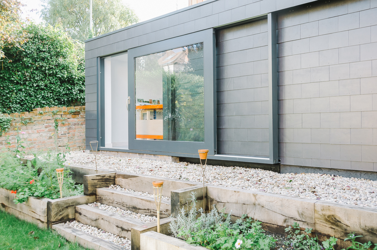 Tile clad garden studio with lift and slide door