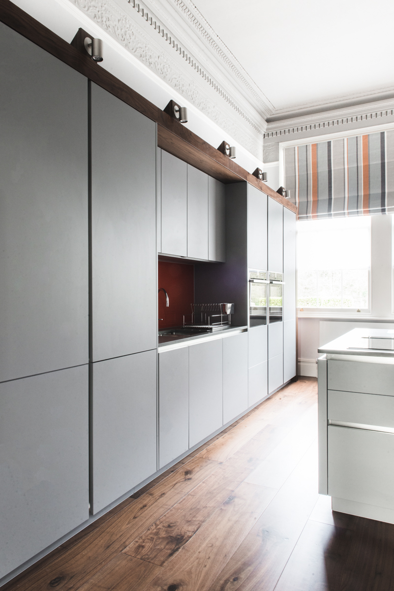 Modern integrated kitchen in ornate period room