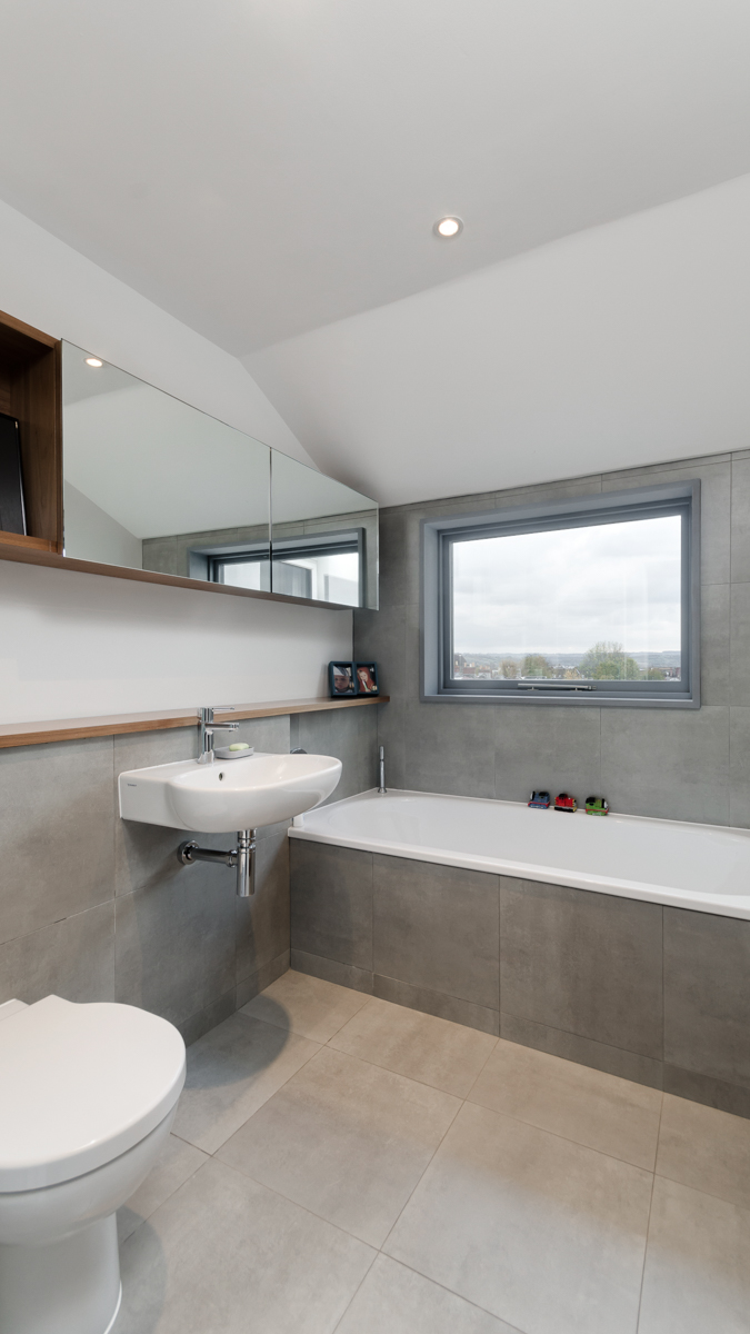 Tiled bathroom with custom medicine cabinet