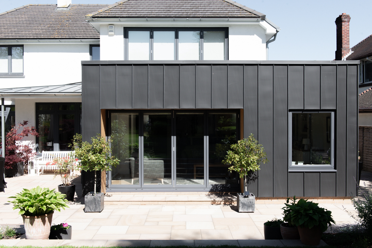 Black zinc extension with bifold doors
