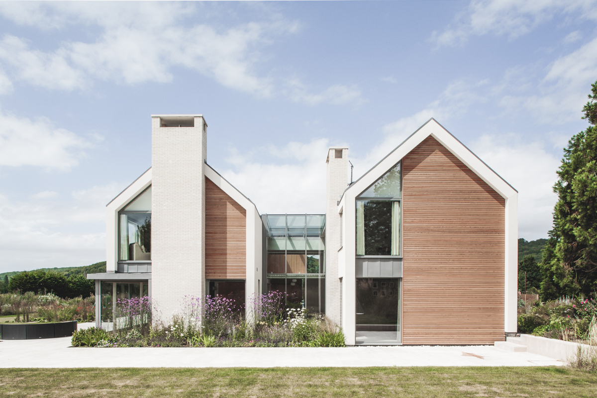 Modern double pitched house with large chimneys