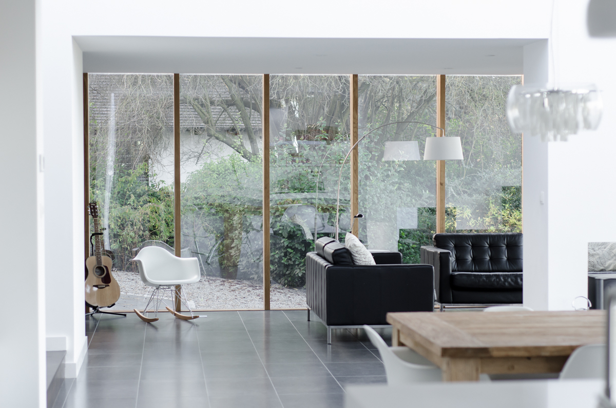 Modernist extension interior with fully glazed wall