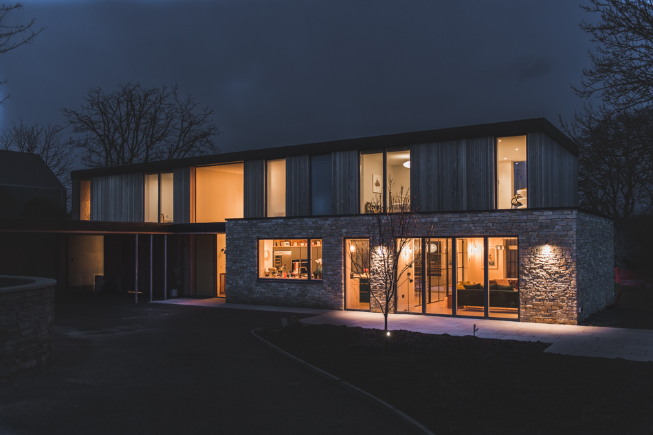 Modern modular new build house at night