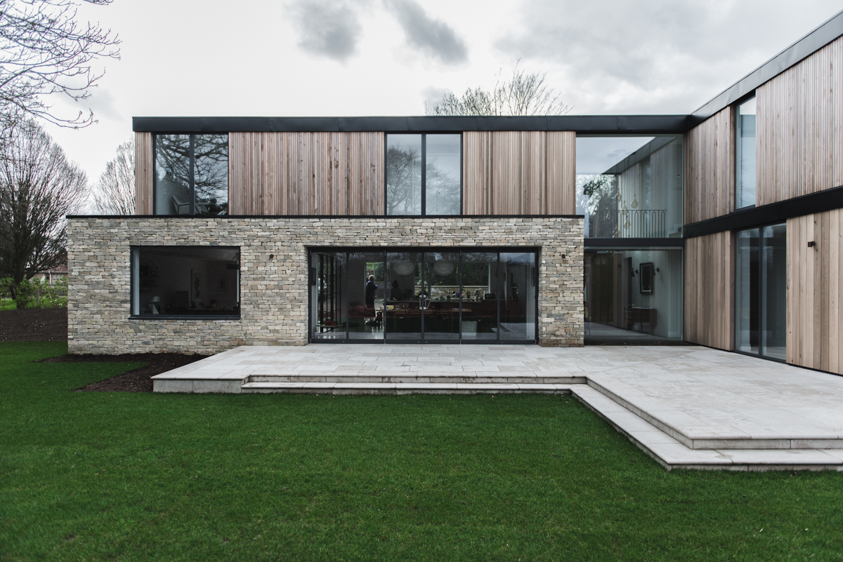Stacked modern stone and timber new build house