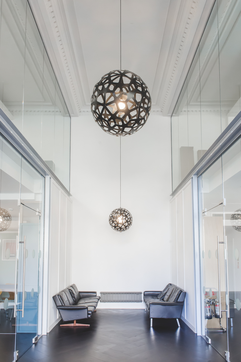 Lobby space with artistic pendant lights