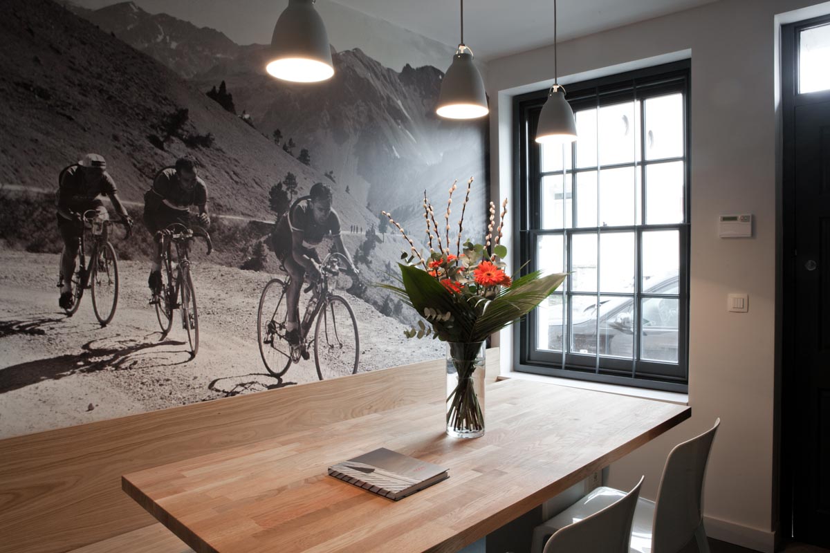 Office meeting room with black and white cycling mural