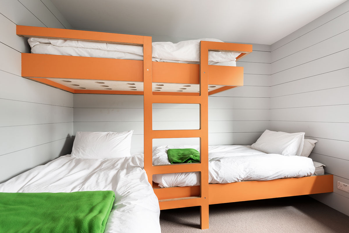Triple kids bunk beds in bright orange